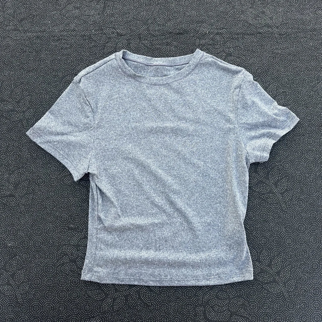 Solid color women's soft breathable yoga short-sleeved comprehensive training tight T-shirt with exposed belly button fitness sh